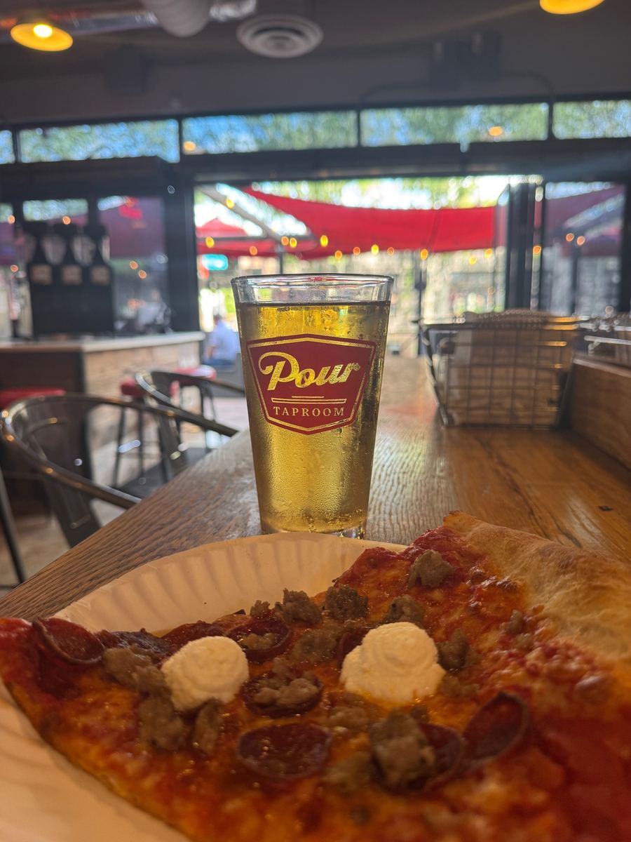 Pizza Dynamo Arthur Ave slice on the patio