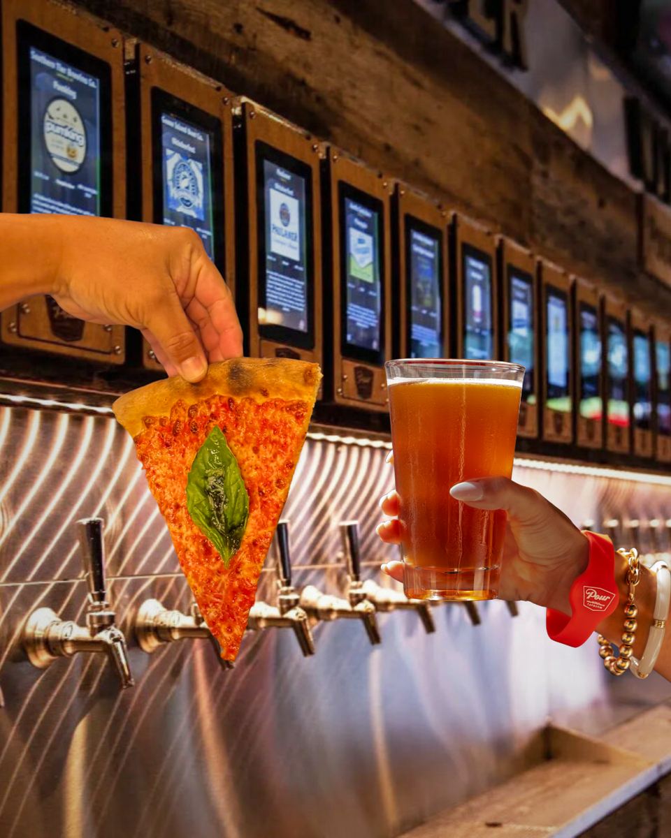 Pizza Dynamo slice and beer at the tap wall
